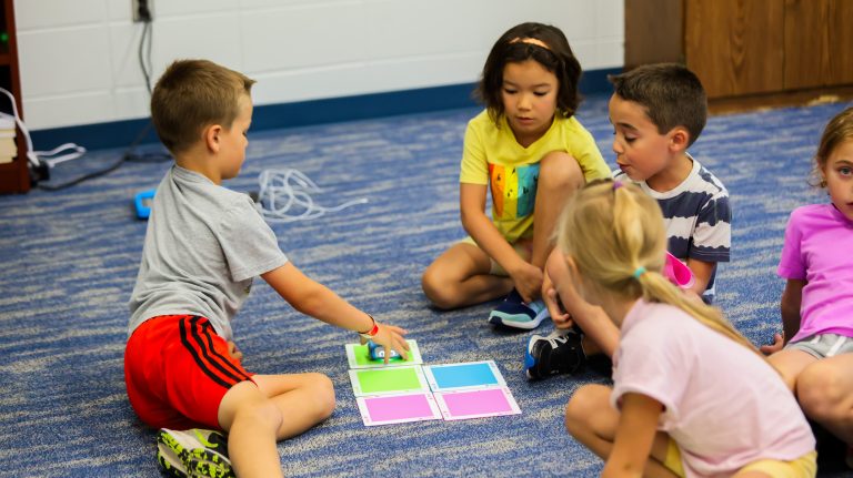 Four young campers participating in group activities during one of the camp programs at one of the Future Stars campuses