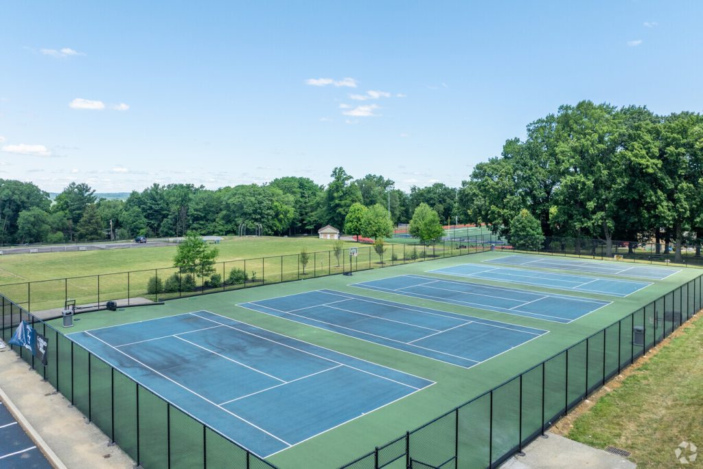 a clean and well-kept tennis court at LaSalle College High School campus