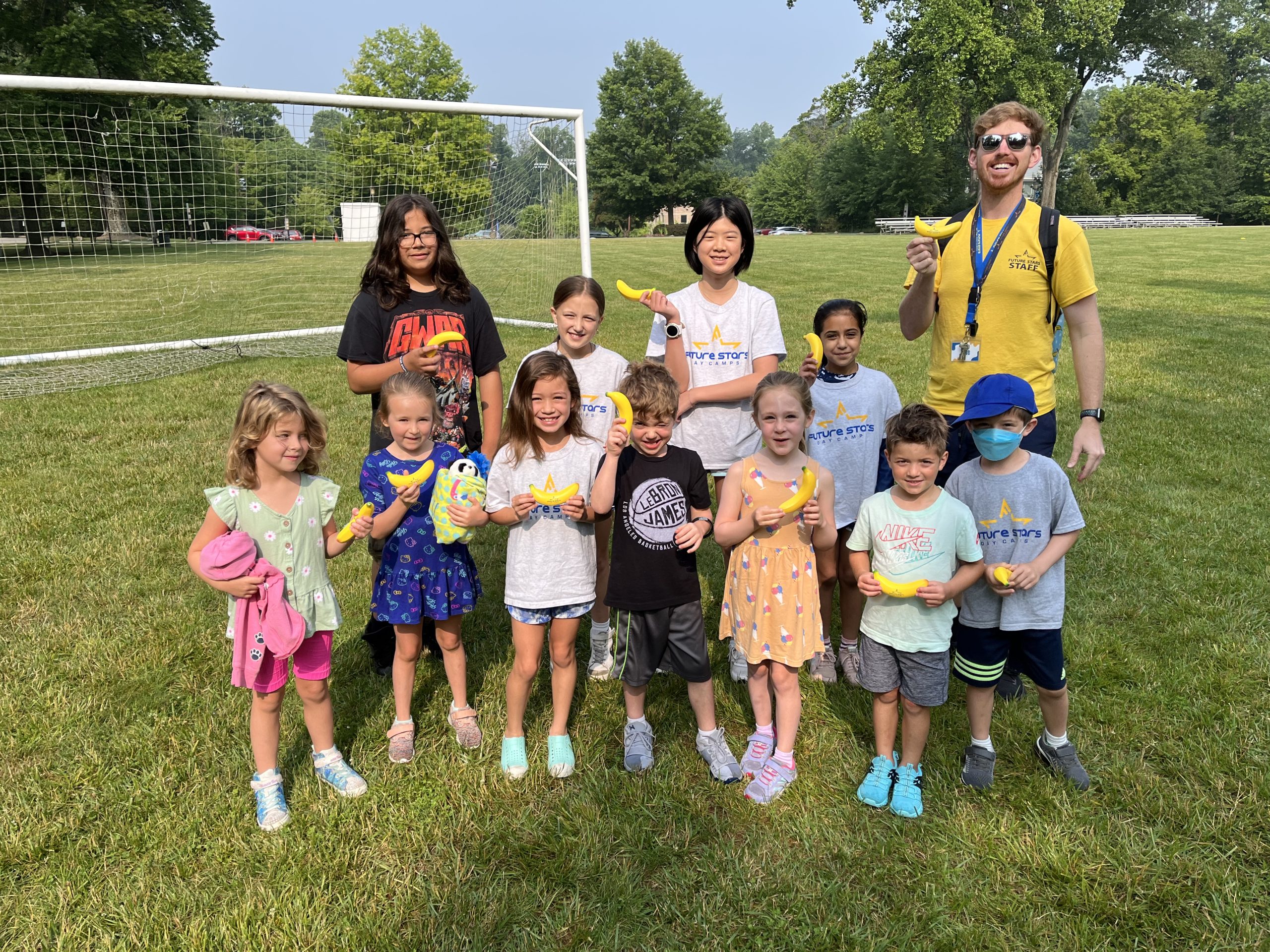 reliable and certified summer camp staff with a group of kids