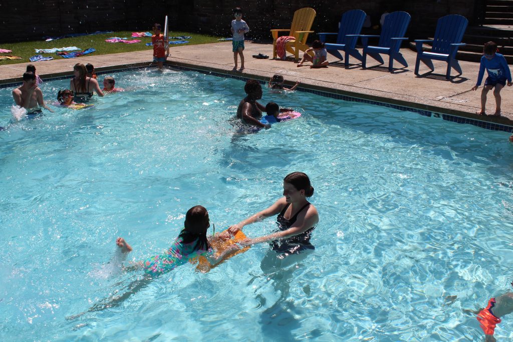 summer camp staff during swimming lessons